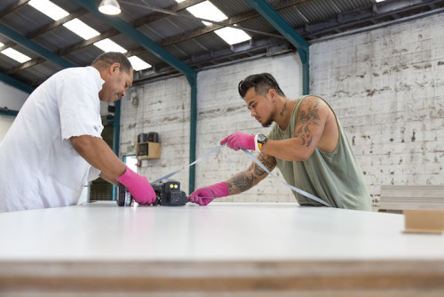 Manual workers together in a warehouse