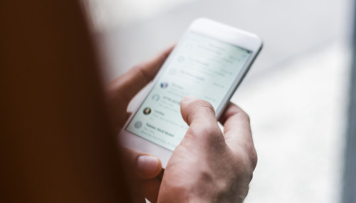 Close-up of man using smartphone