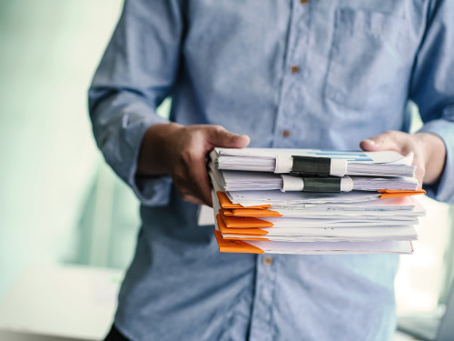 a man holding documents