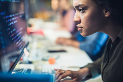 African American woman concentrating on computer screen