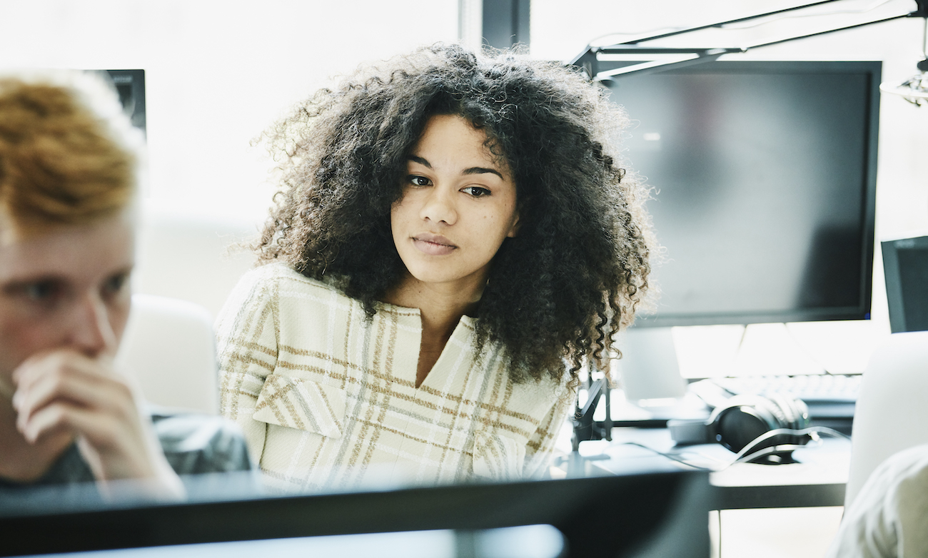 Portrait of female engineer working in computer lab