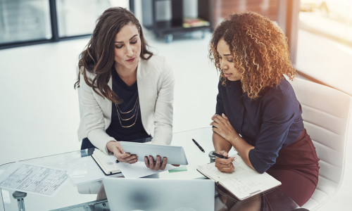 women discussing electronic signatures and NDAs