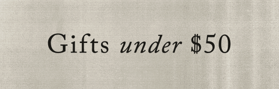 Text reading "Gifts under $50" in black serif font on a beige textured background