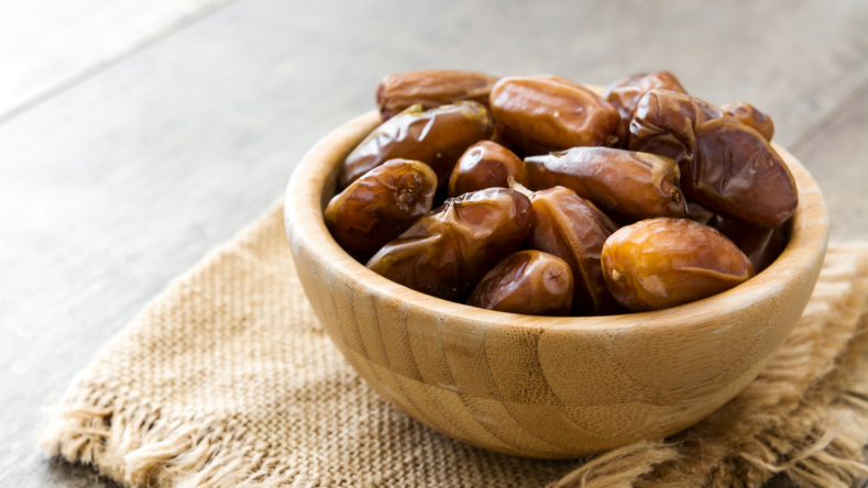 dates in a wooden bowl