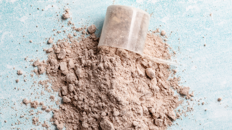 Chocolate protein powder in a scoop