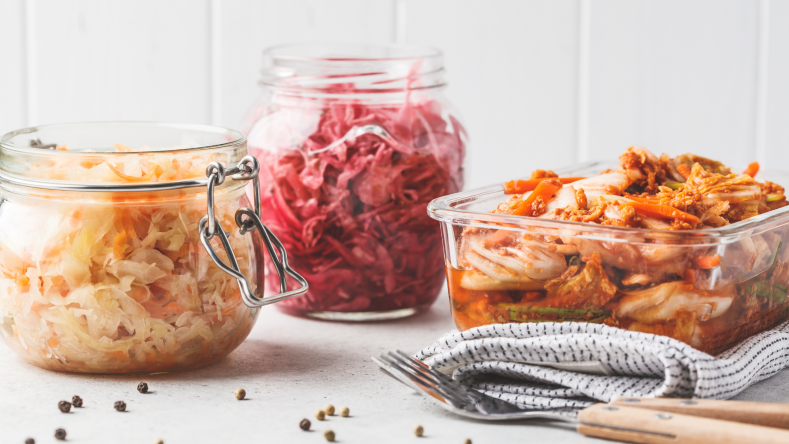kimchi and sauerkraut in glass jars