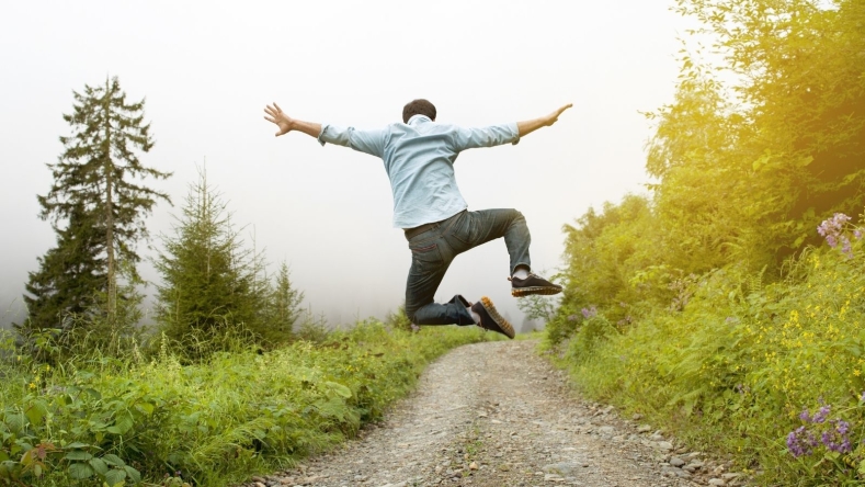 Man on a trail jumping