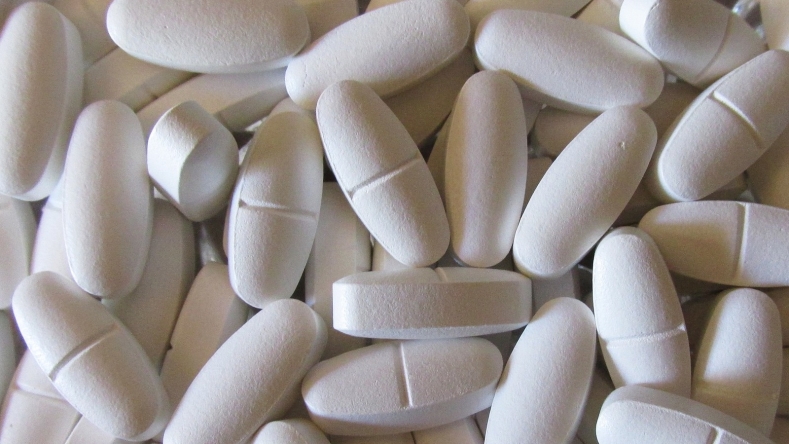 pile of white calcium tablets