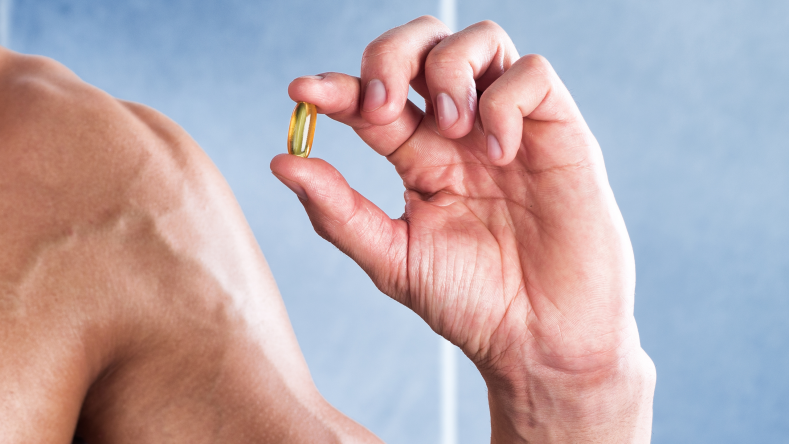 man holding one supplement