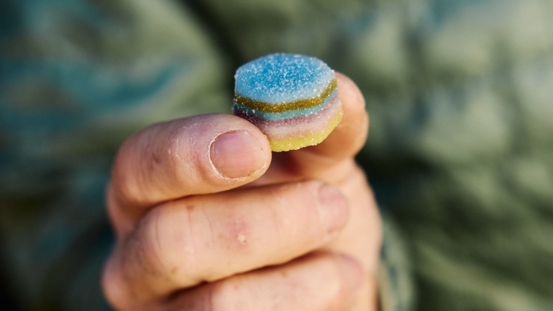 Tommy Caldwell holding gummies