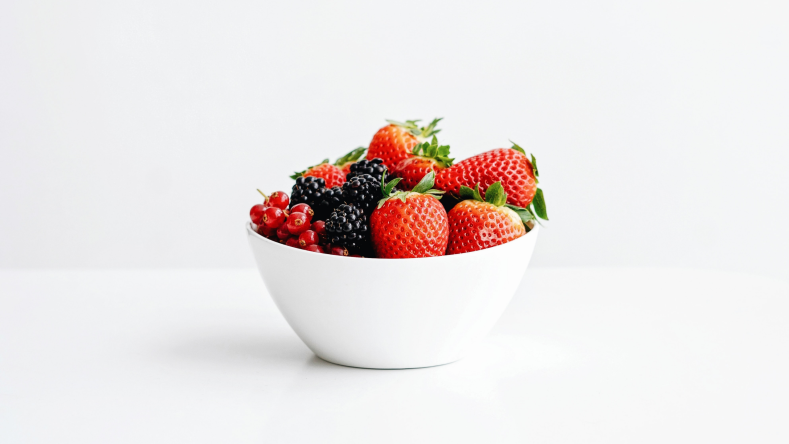 assorted berries in a white bowl