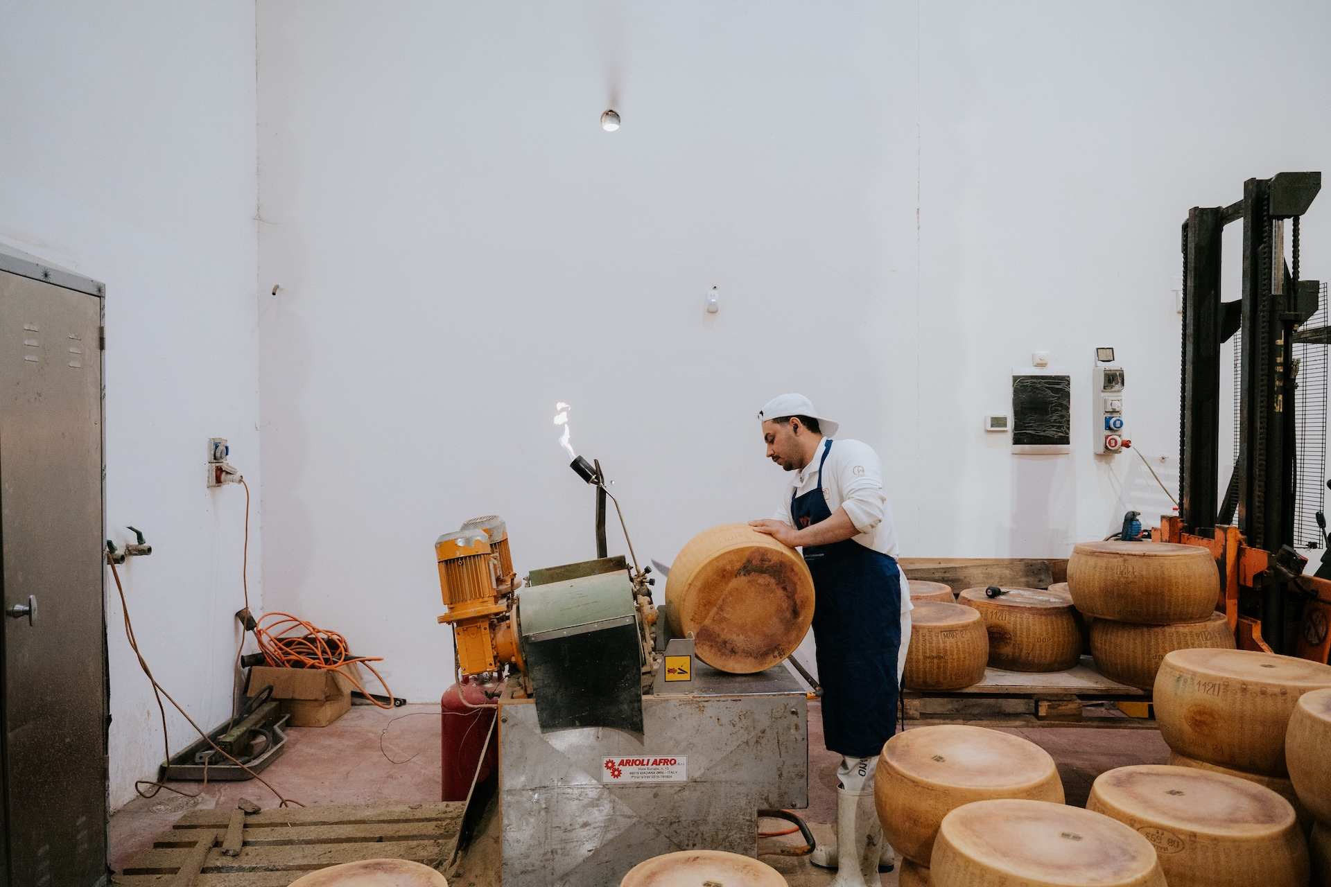 A man makes cheese in Bologna