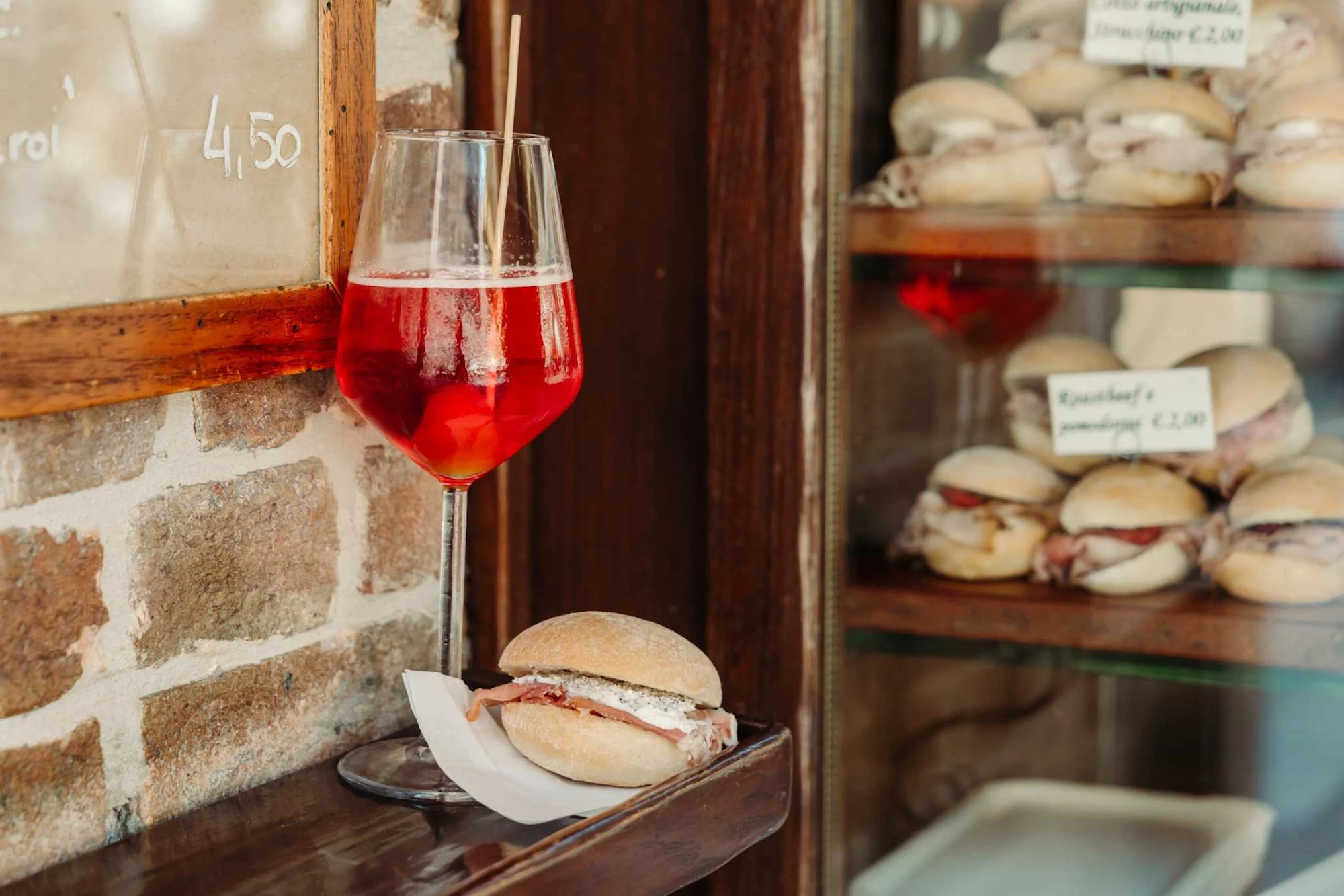Enjoying an Aperol Spritz aperitivo during WalksDevour's Venice at Sunset: Cicchetti, Food & Wine Tour