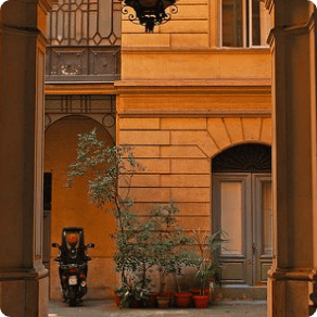 Motorbike on a street in Rome as seen from inside an archway