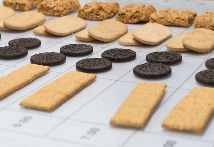 Various cookies and biscuits sit on a measuring table