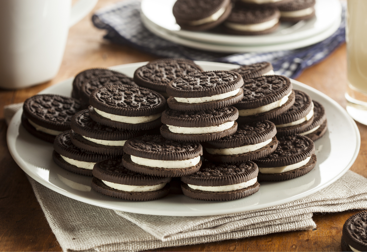 Chocolate sandwich cookies with white icing in the middle