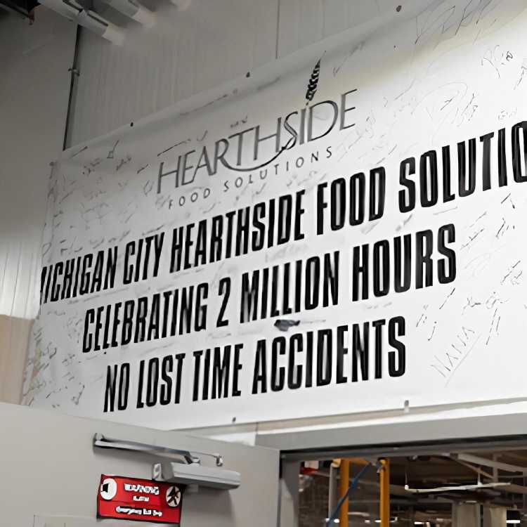 A banner reading 'Michigan City Hearthside Food Solutions: Celebrating 2 Million Hours No Lost Time Accidents'