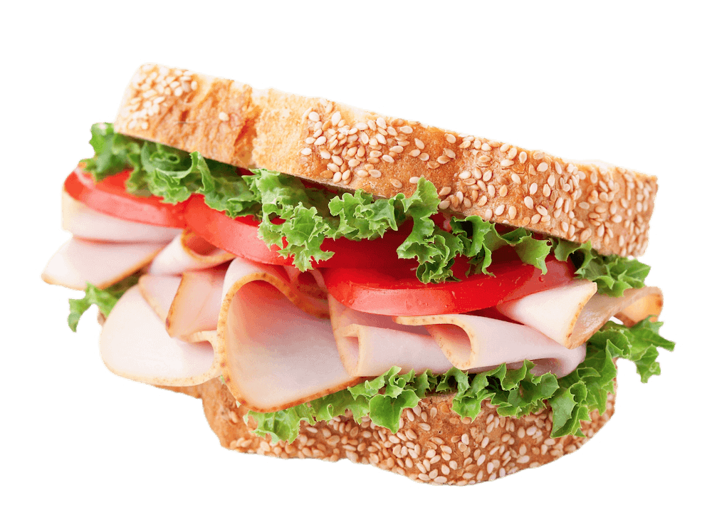 A ham sandwich with tomatoes and lettuce on poppyseed bread