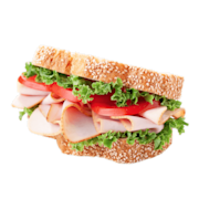 A ham sandwich with tomatoes and lettuce on poppyseed bread