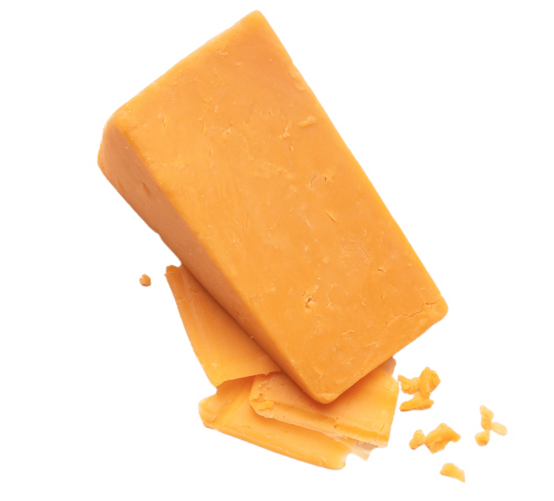 A large block of cheese sitting atop a few small slices.