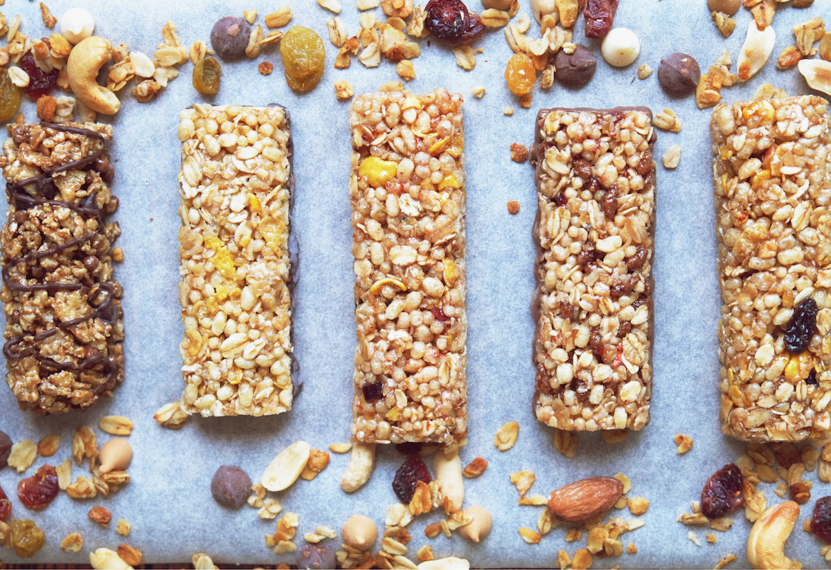 A line of five baked bars, filled with nutritious ingredients