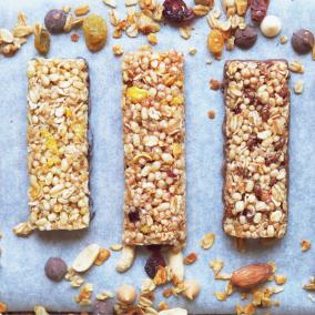 A line of five baked bars, filled with nutritious ingredients