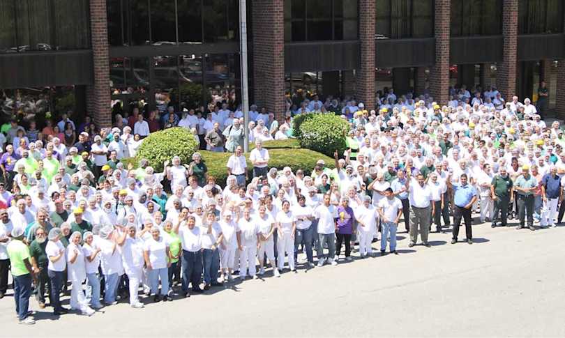 An outdoor photo of the Hearthside team celebrating.