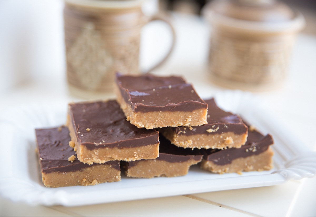 A stack of six cold-form bars with two layers each, sitting on a white plate