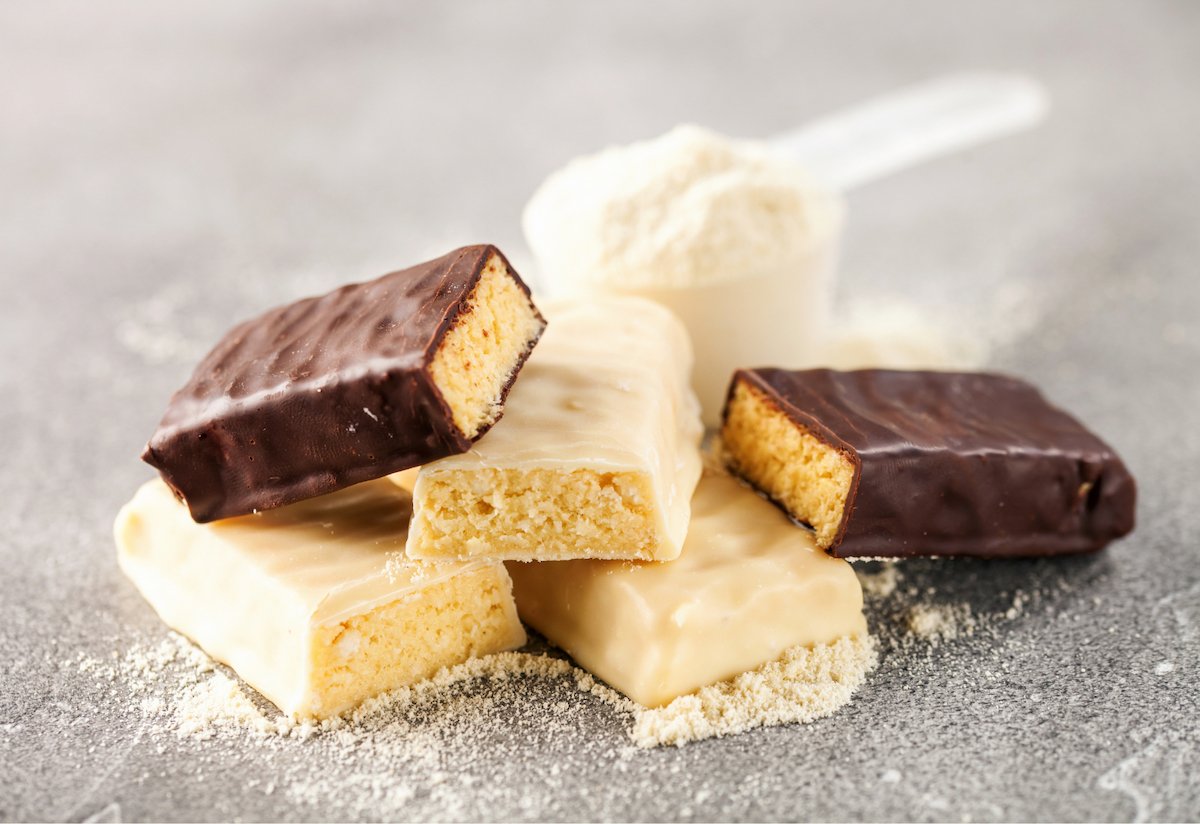 Three protein bars, broken into halves.