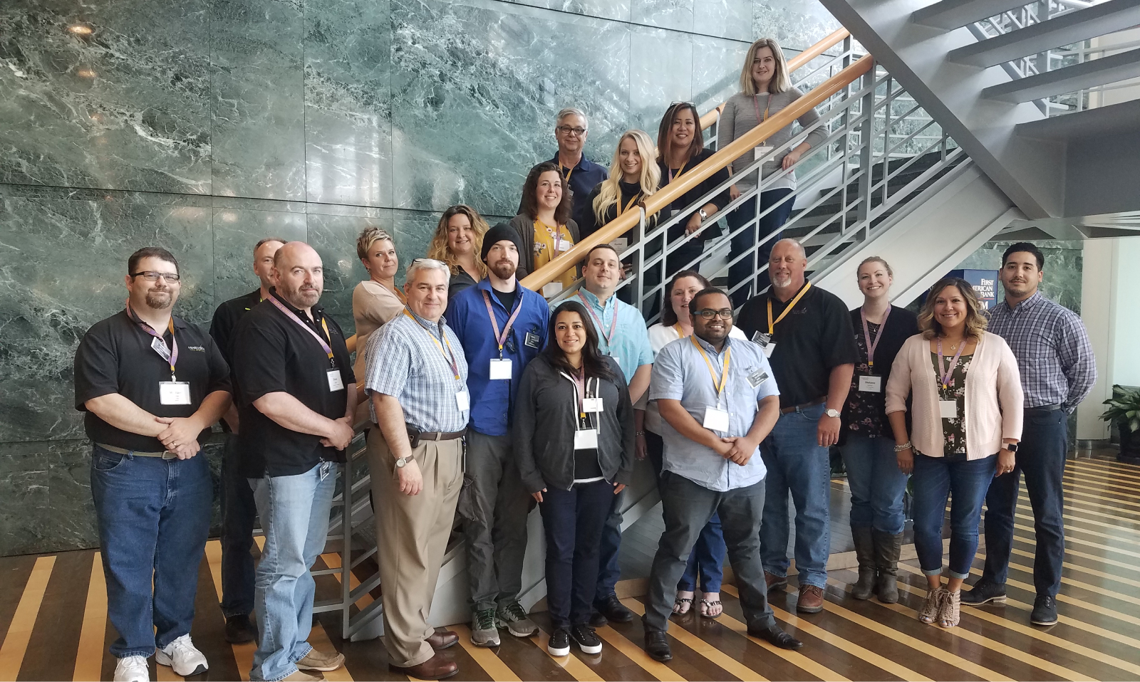 Hearthside employees pose for a photo on a stairwell.