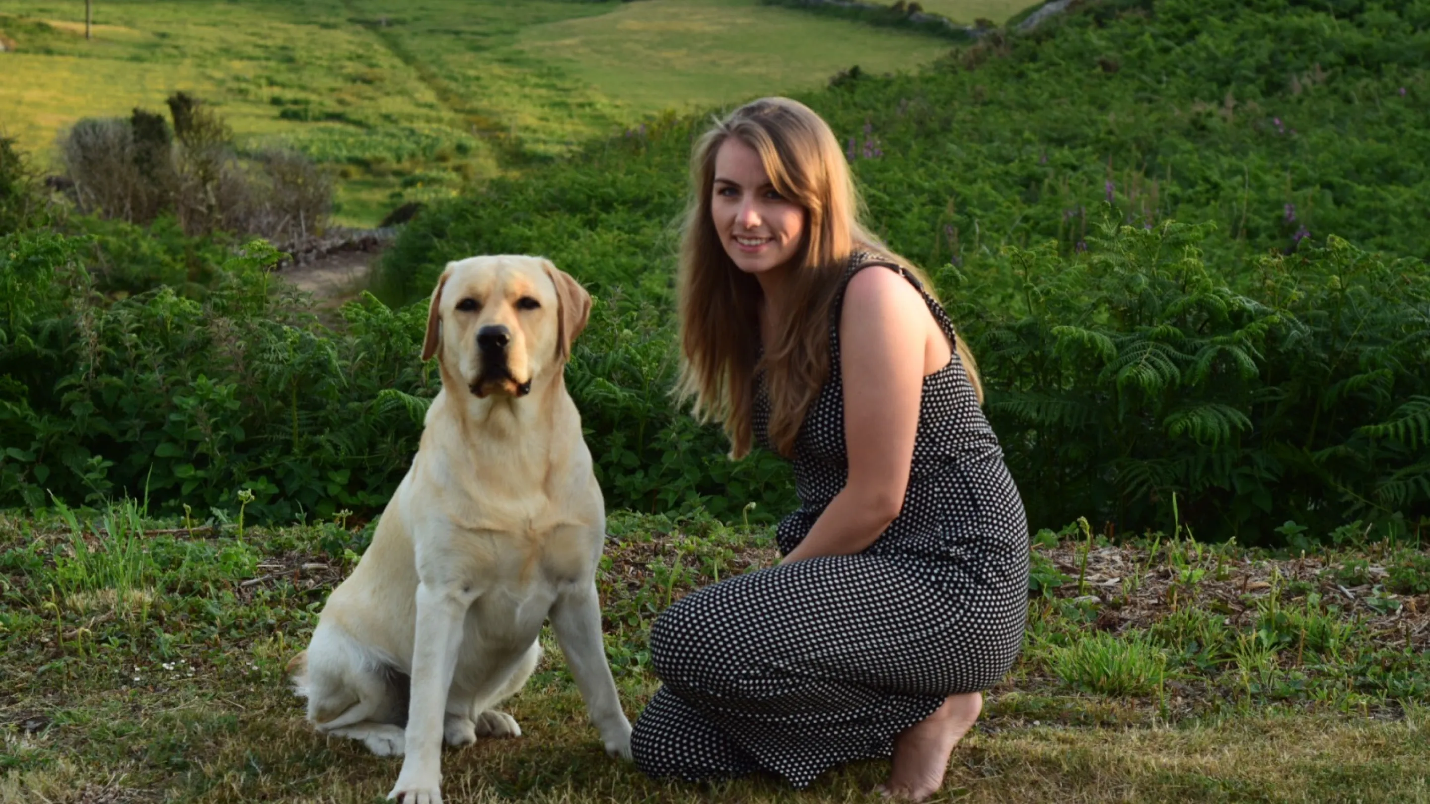 Paige and Shadow in a field