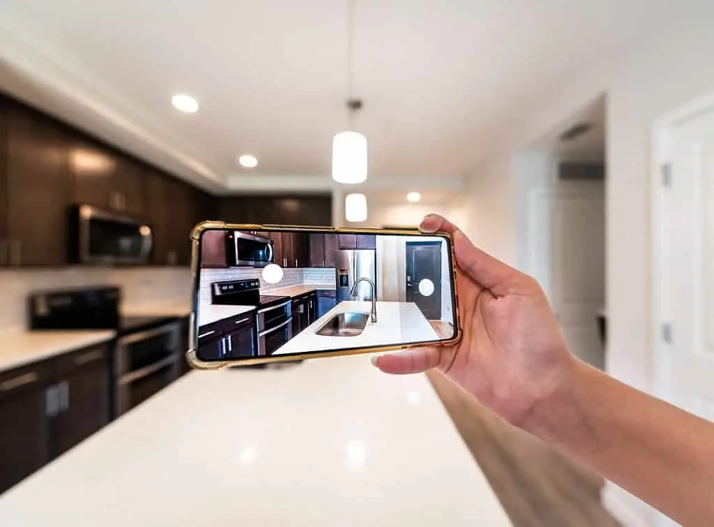 https://www.checkatrade.com/blog/wp-content/uploads/2022/06/customer-taking-picture-of-kitchen-as-user-generated-content-example.jpeg