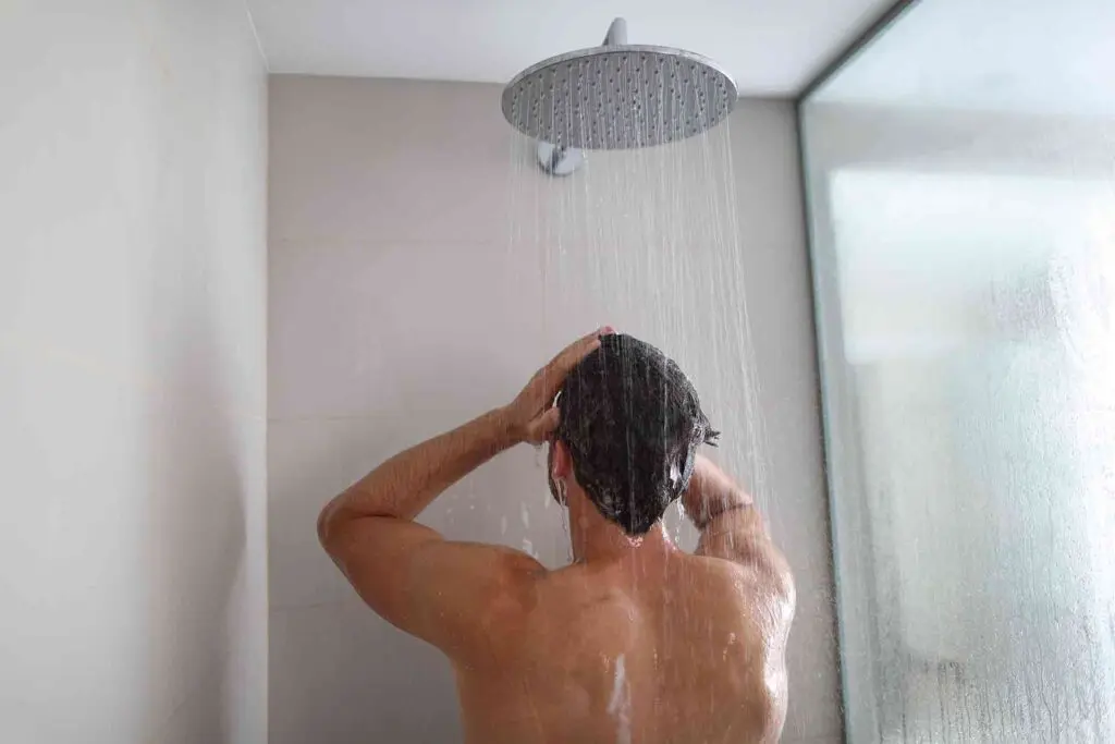 Man using a power shower