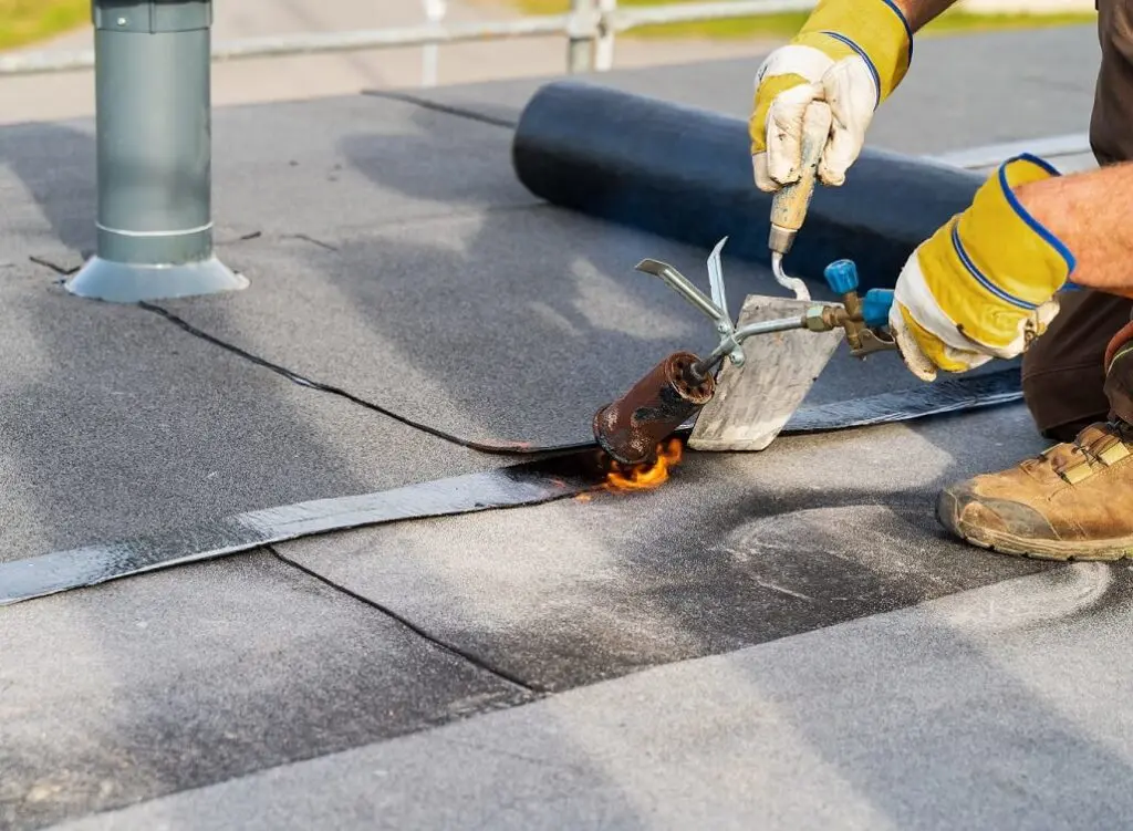 https://www.checkatrade.com/blog/wp-content/uploads/2025/03/repair-work-on-flat-roof-1024x751.jpeg