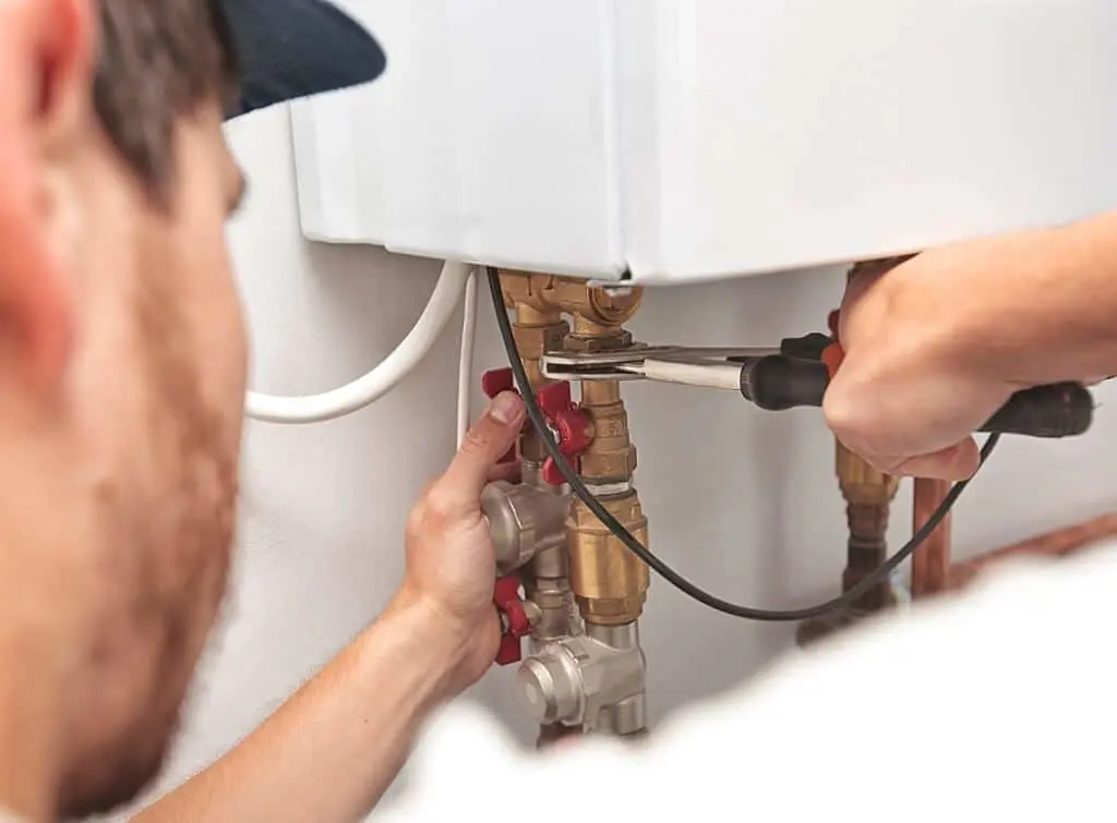 https://www.checkatrade.com/blog/wp-content/uploads/2025/01/boiler-engineer-operating-in-local-area.jpeg