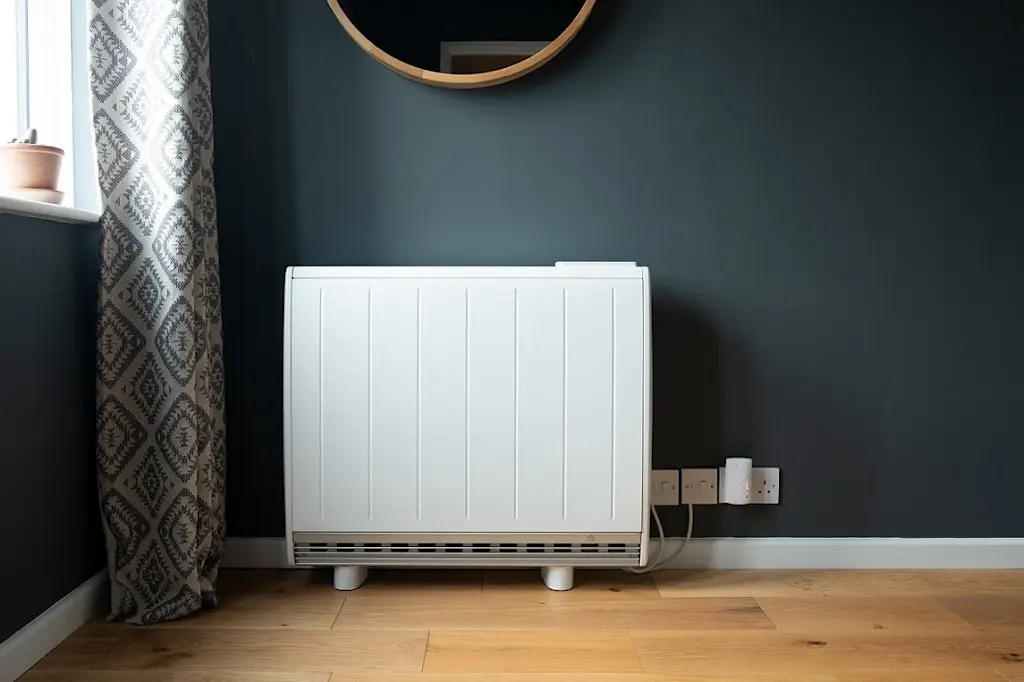 Storage heater on wall