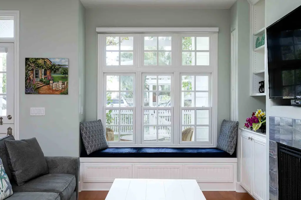 The panelled window seat perfectly complements the home's architraves and built-in storage