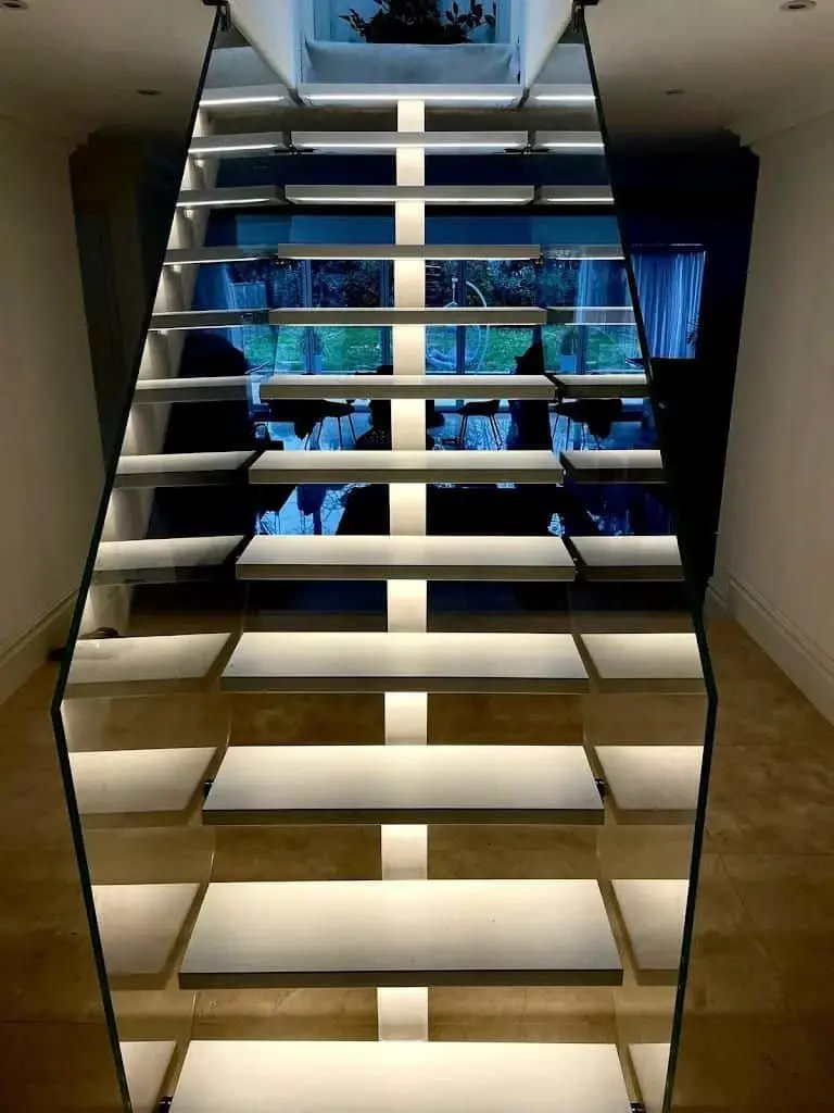 Metal floating stairs with glass