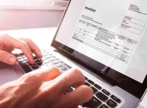 planning consultant typing on computer