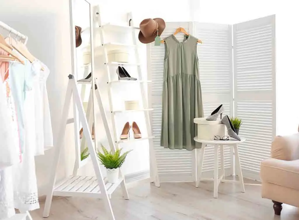 add freestanding furniture to a small walk in wardrobe idea