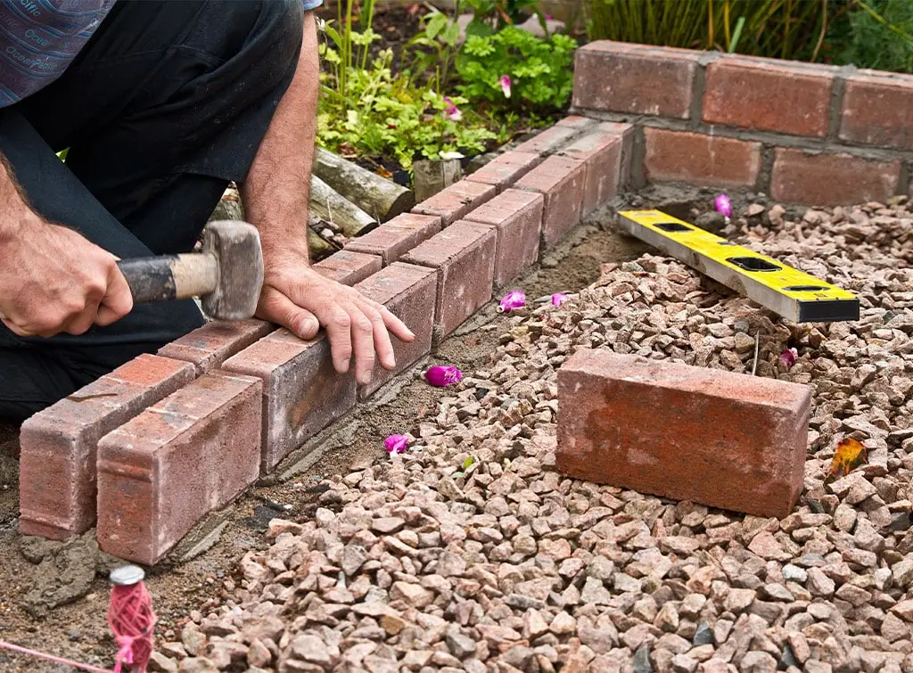 https://www.checkatrade.com/blog/wp-content/uploads/2022/03/cost-to-build-a-brick-wall-1.jpg