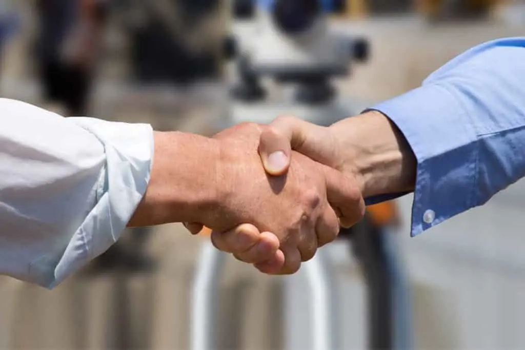 Two men shaking hands: building relationships in business