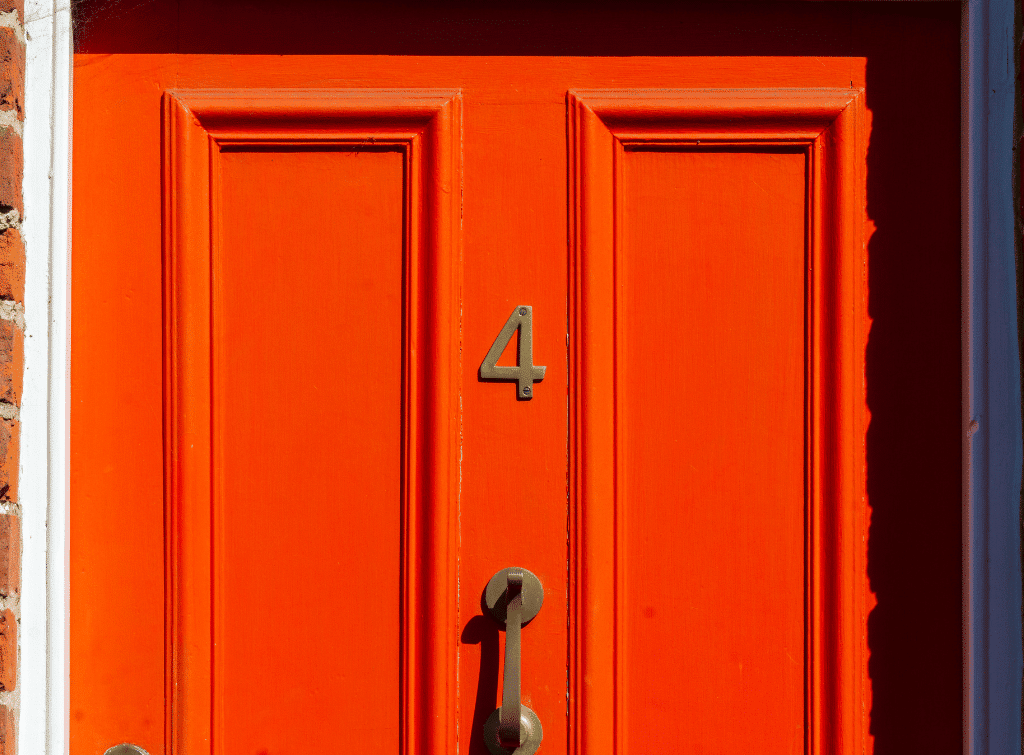 Painted orange front door 