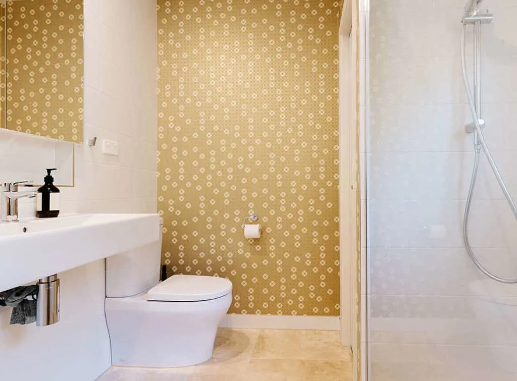 perk up a plain bathroom with wallpaper