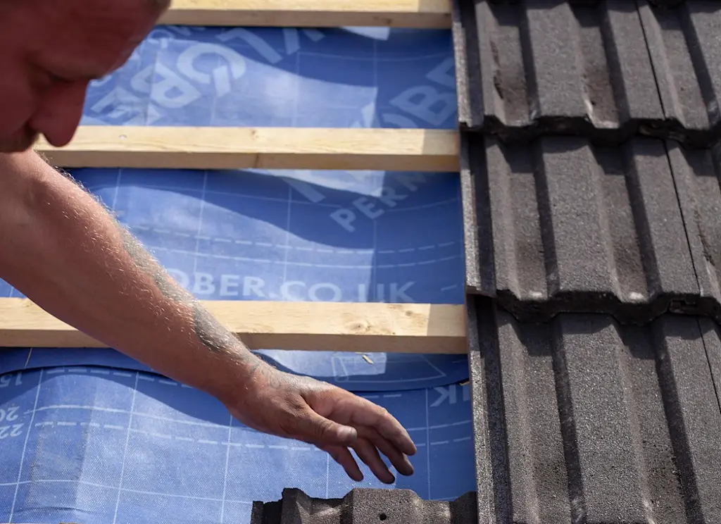 Roof tilers working