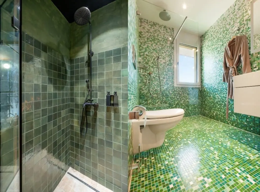 https://www.checkatrade.com/blog/wp-content/uploads/2023/10/Green-mosaic-wet-room-tile-design.jpg