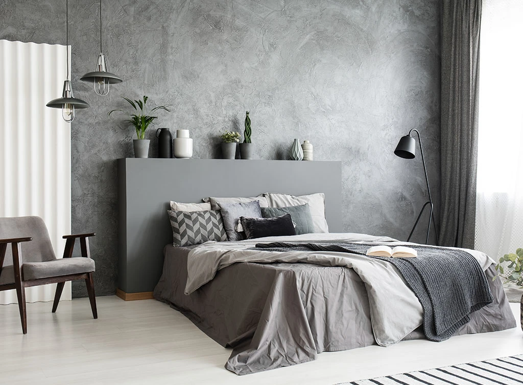 grey bedroom with statement headboard