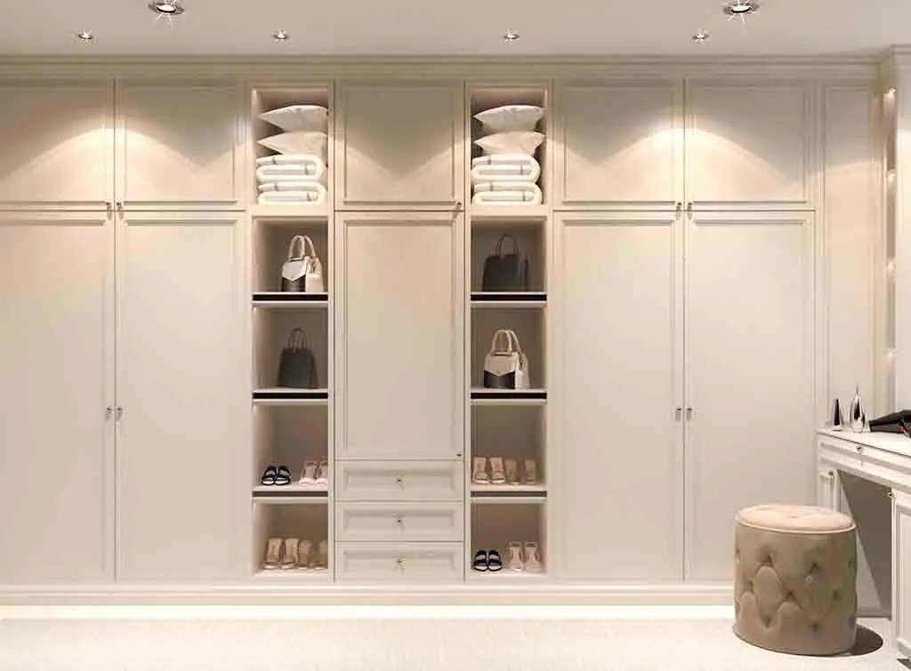 stretch cupboards to the ceiling in a small walk in wardrobe
