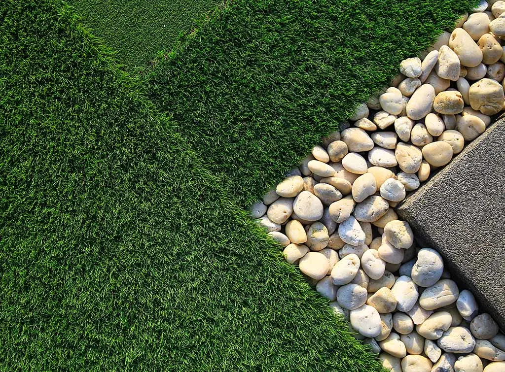 Artificial grass, stone paving blocks, and stone for outdoor flooring
