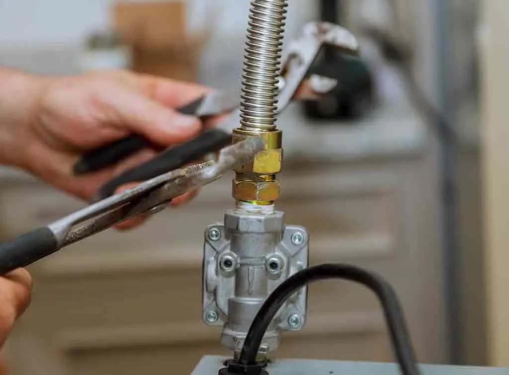 gas cooker hose being connected